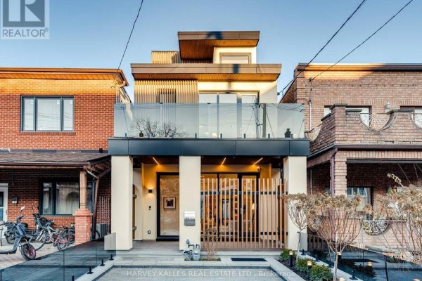Modern home with glass balcony and wood slats - 179 Palmerston Avenue Toronto