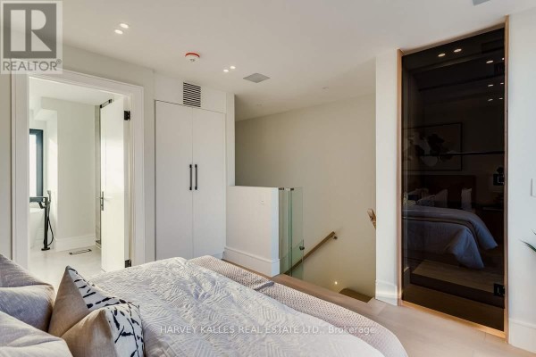 Bedroom with wardrobe and glass stairs - 179 Palmerston Avenue Toronto