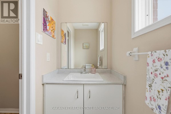Single sink vanity with large mirror and towel rack - 18 Chapman Court London North