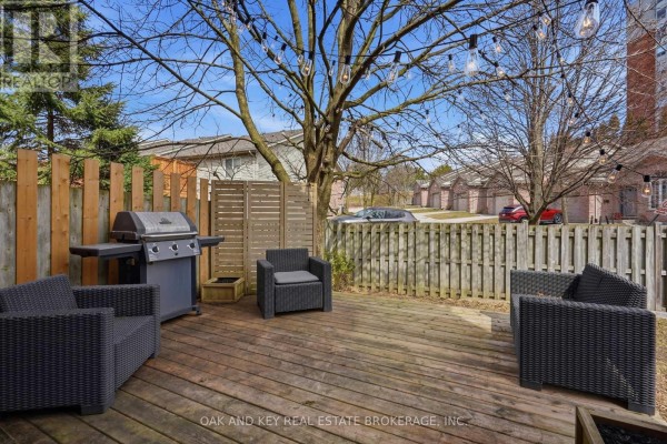 Deck with grill, seating, and string lights - 18 Chapman Court London North