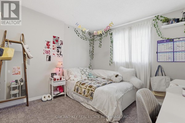 Bedroom with bed, mirror, calendar, and hanging plants - 18 Chapman Court London North