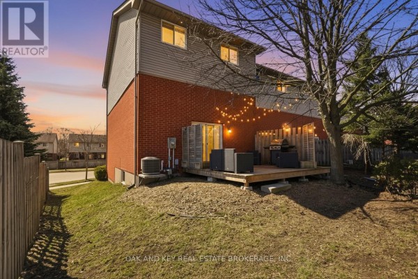 Deck with grill, seating, and string lights - 18 Chapman Court London North