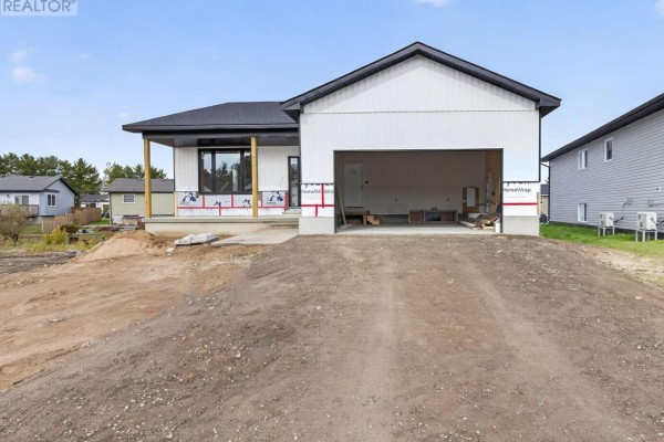 Interior view of a white front door with a frosted glass panel to the right. - 18 Durant Street, Petawawa