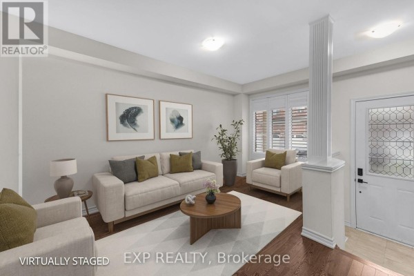 Living room with a sofa, armchairs, coffee table, fireplace, and a large window with blinds. - 18 Hough Lane, Ajax