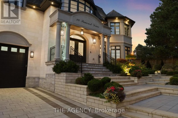 Entryway featuring a circular marble floor design and chandelier. - 18 Suncrest Drive, Toronto