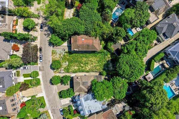 Overhead aerial view of the rectangular vacant lot at 180 Dunvegan Road, Toronto, with neighboring properties. - 180 Dunvegan Road, Toronto