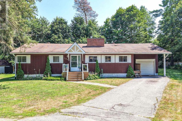 Street view of a brown bungalow with a detached garage and a paved driveway. - 180 Lofty Pines Crescent, Gravenhurst)