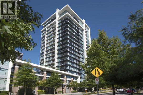 Street view of a modern white apartment building with glass balconies and green trees. - 1801 158 W 13th Street, North Vancouver