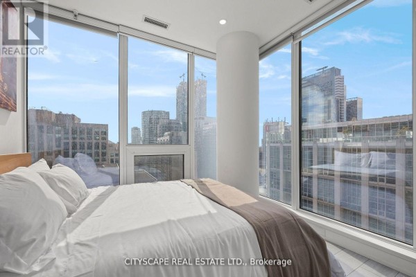 Modern bathroom with glass shower, white vanity, and storage shelves - 1802 - 55 Mercer Street S, Toronto