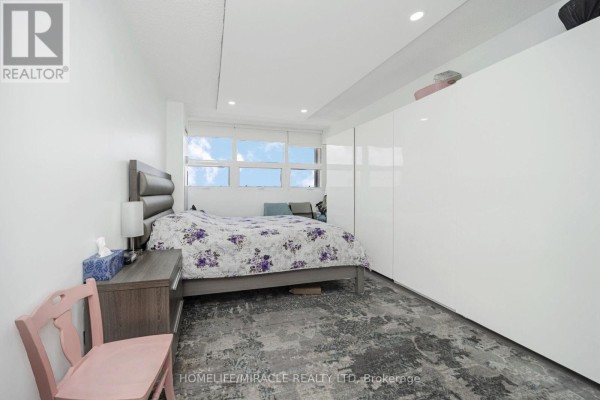 Bedroom with large windows and modern closet - 1802 - 8 Lisa Street Brampton