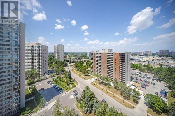 Apartment buildings, parking lots, and road - 1802 - 8 Lisa Street Brampton