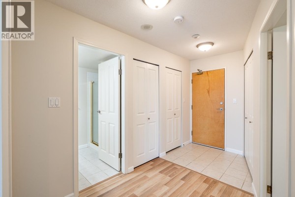 Hallway inside the apartment leading to bedrooms and front door. - 1803 7077 Beresford Street, Burnaby