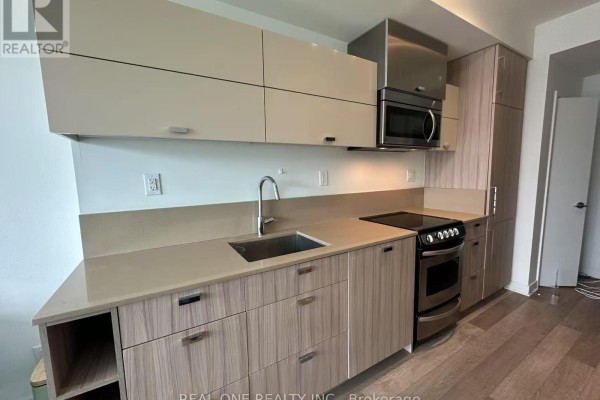Contemporary kitchen with light wood cabinets, stainless steel appliances, and stone countertops. - 1807 - 290 Adelaide Street W, Toronto