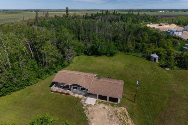 Distant aerial view highlighting the property's boundary line in red, encompassing the house and various structures. - 18073 Pr 329 Road Road, Riverton