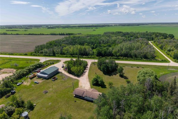 Aerial perspective showing the full extent of the property outlined in red, bordered by fields and roads. - 18073 Pr 329 Road Road, Riverton