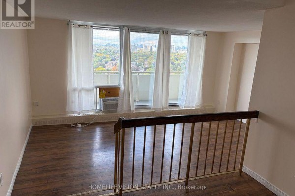 Room with large windows, white curtains, and a view of the city skyline. - 1808 - 1338 York Mills Boulevard, Toronto