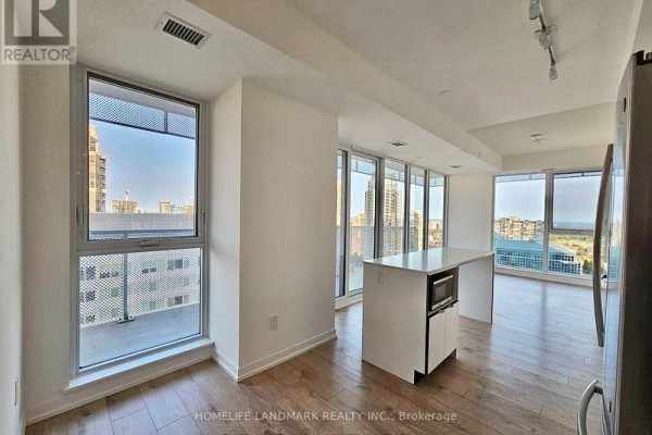 Empty room with large window offering views of the city and distant landscape - 1808 - 4065 Confederation Parkway, Mississauga