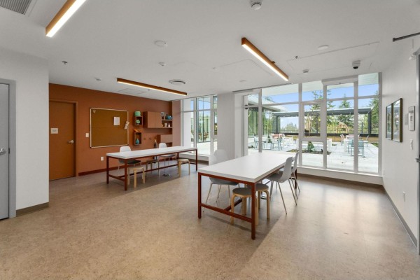 Street view of the apartment building featuring a mix of glass and concrete design elements. - 1810 13675 107a Avenue, Surrey