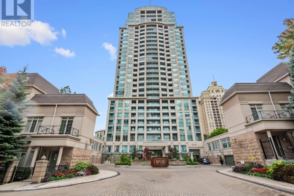 Wide shot of the condominium building entrance with surrounding low-rise structures. - 1814 - 17 Barberry Place, Toronto