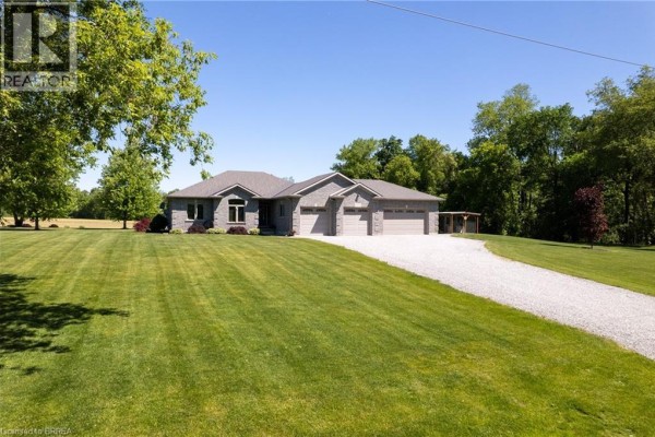 Corner kitchen with dark wood cabinets, stainless steel appliances, and island seating. - 1827 Windham Road 3, Scotland