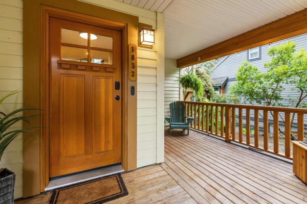 Wooden front door with glass insert and porch railing. - 1832 Huckleberry Bend, Cultus Lake South, Cultus Lake