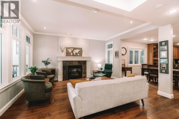 Open living space with staircase, hardwood floors, and access to dining area. - 1845 Harbour Street, Port Coquitlam