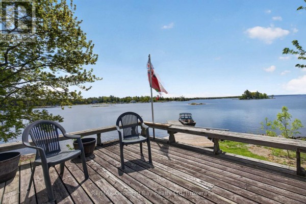 Deck with chairs and a view of Georgian Bay. - 185 Picnic Island Road, Georgian Bay