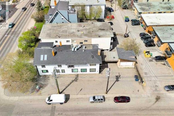 Aerial view of commercial buildings with parking lots and street traffic. - 1850 14 Street Sw, Calgary