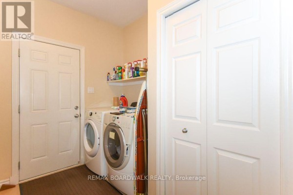 Laundry room with washer, dryer, shelf, panel door - 1861 Mickelberry Crescent Ottawa