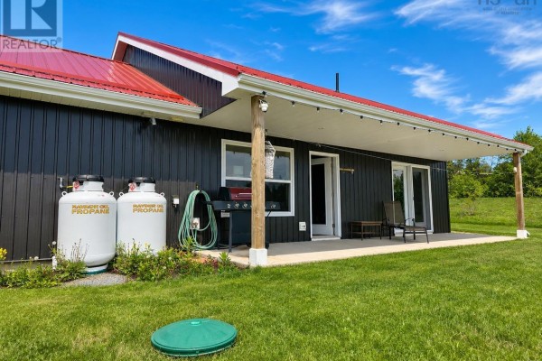 Front of a detached garage with two black doors and white side door. - 1874 Brow Of Mountain Road W, Viewmount