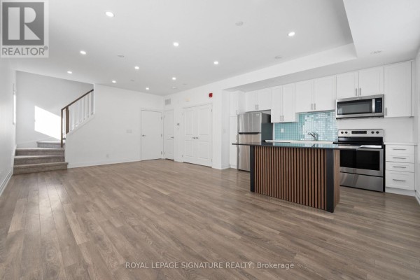 Living room - 19 - 100 Long Branch Avenue, Toronto, ON M8W0C1 Photo 2
