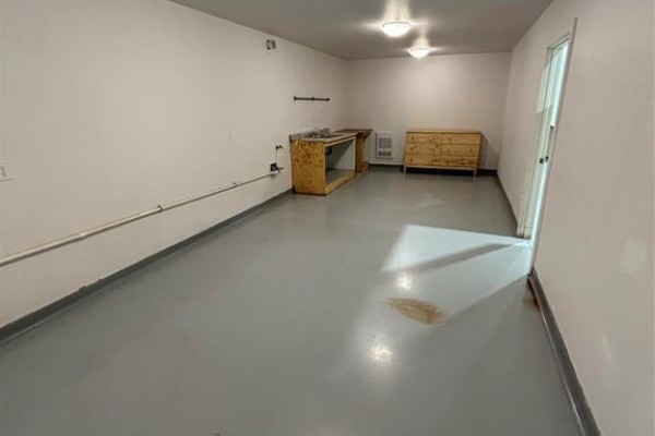 Another room with gray flooring, countertop, and storage unit - 19 733 North Link Road, Ile Des Chenes