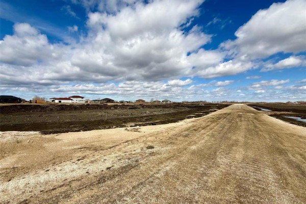 Flat snowy area with mounds and a distant horizon line - 19 Boyde Road, West St Paul