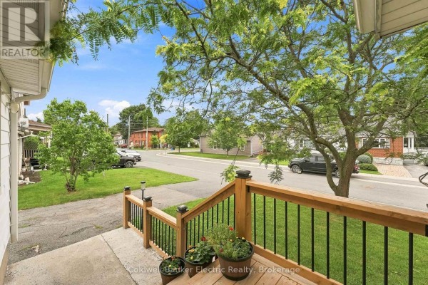 View from the wooden porch looking out onto the street and surrounding neighbourhood. - 19 Graham Street E, Greater Napanee