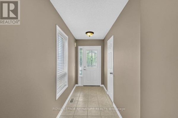 Family room - 19 Mossgrove Crescent, Brampton, ON L7A3E6 Photo 4