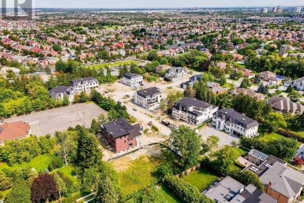 Overhead view of a developing neighborhood with new construction and existing homes. - 19 Sunman Court, Markham