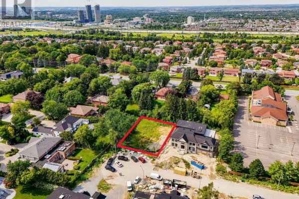 Aerial perspective showing a vacant lot outlined in red, near residential buildings and trees. - 19 Sunman Court, Markham