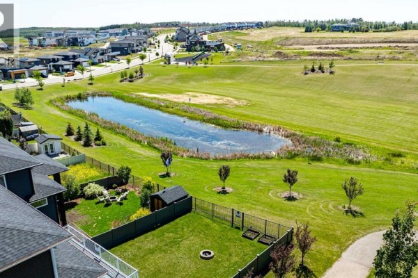 Aerial view of the property showcasing the roof and surrounding area. - 19 Vanveller Way, Sylvan Lake