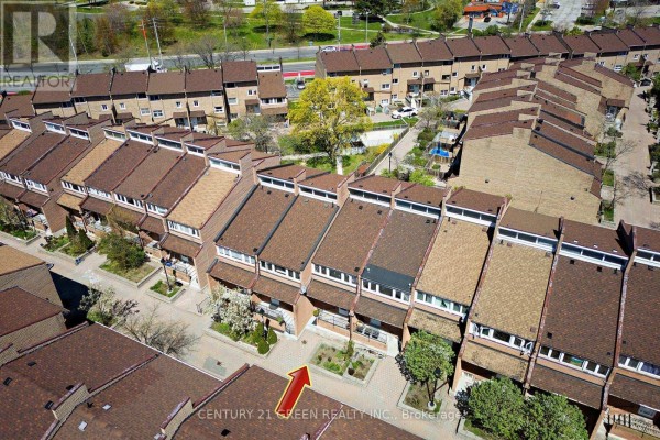 Aerial view showing a section of the townhouse complex with a red arrow pointing to one unit. - 190 - 50 Scarborough Golf Club Road, Toronto