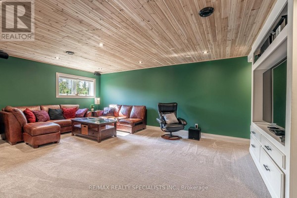 Leather sectional, recliner, and wood ceiling in living room - 190 Courtland Street Blue Mountains
