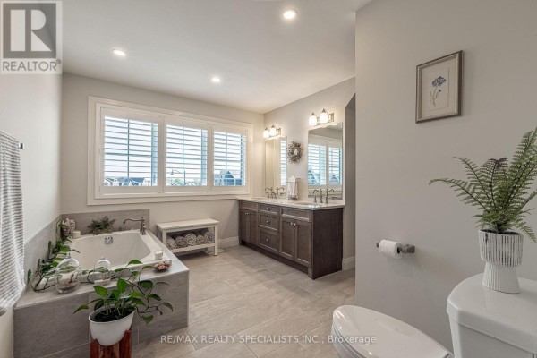 Soaking tub and double vanity bathroom with plantation shutters - 190 Courtland Street Blue Mountains