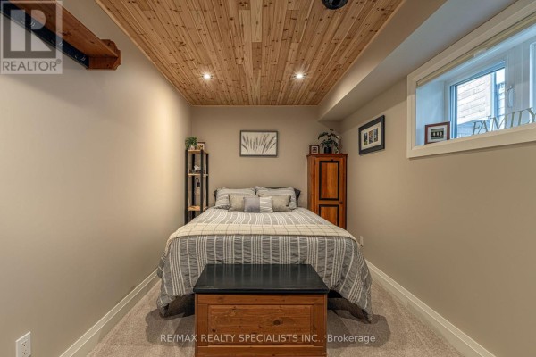 Bedroom with wood plank ceiling, bed, and wardrobe - 190 Courtland Street Blue Mountains
