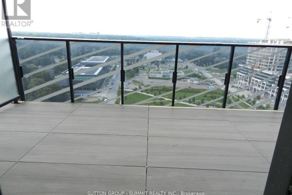 Balcony view with large tiles and a railing overlooking the surrounding area and skyline. - 1908 - 25 Mcmahon Avenue, Toronto