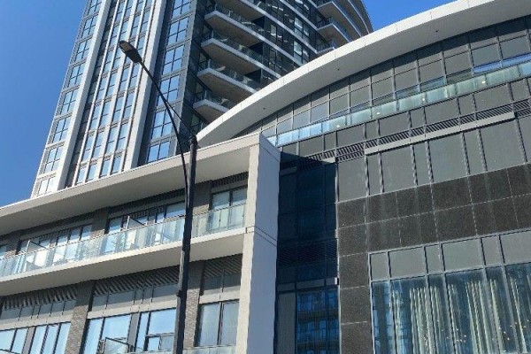Close-up view of modern apartment building architecture with glass windows and balconies. - 1913 - 35 Watergarden Drive, Mississauga