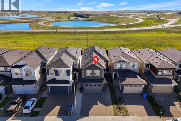 Aerial view of a suburban street with multiple townhouses, showing the property's location. - 192 Cornerbrook Road Ne, Calgary