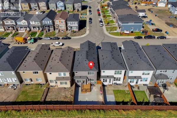 Aerial view of the street and backyard of the property, showcasing the neighborhood layout. - 192 Cornerbrook Road Ne, Calgary
