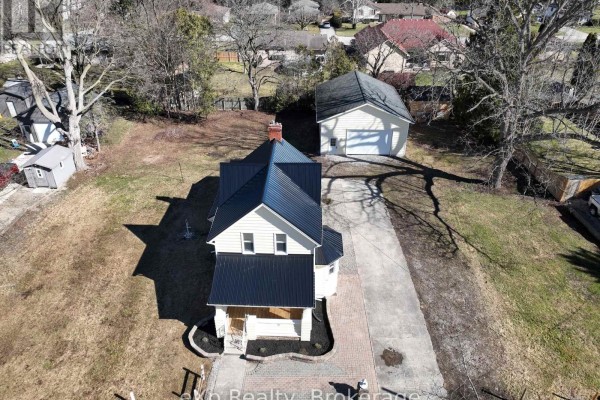 House with black metal roof and garage - 192 William Street W North Middlesex