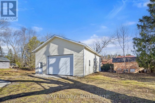 Detached garage with white door - 192 William Street W North Middlesex