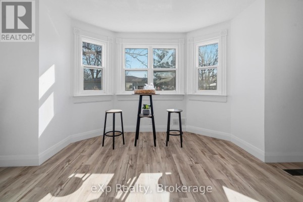 Bay window with stools and accent table - 192 William Street W North Middlesex