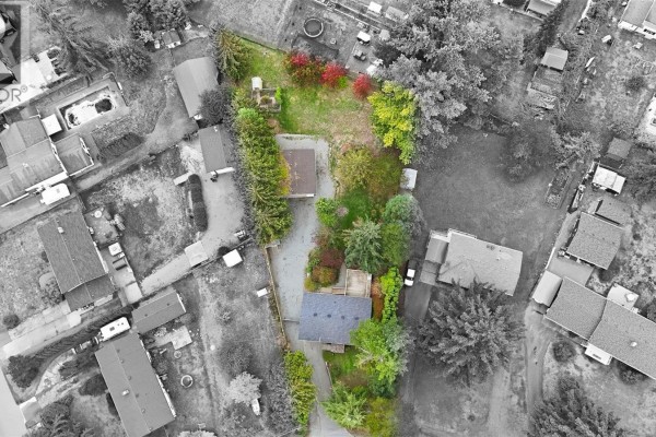 Aerial view of the property at 1951 Szasz Dr, Nanaimo, showing the house and yard. - 1951 Szasz Dr, Nanaimo